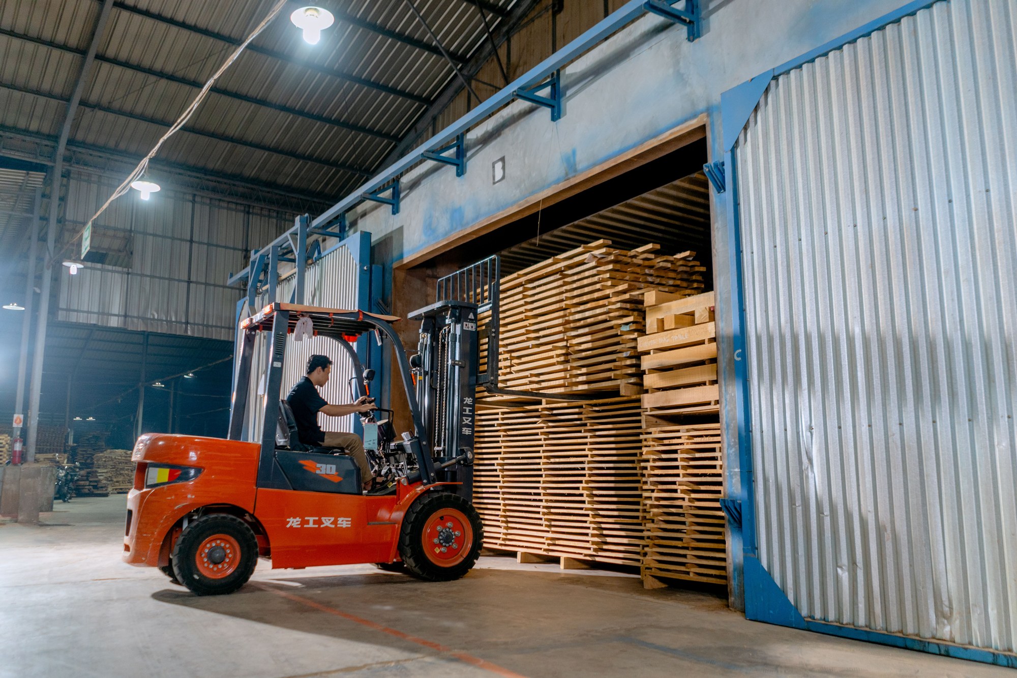 Loading equipment handling freight at a warehouse