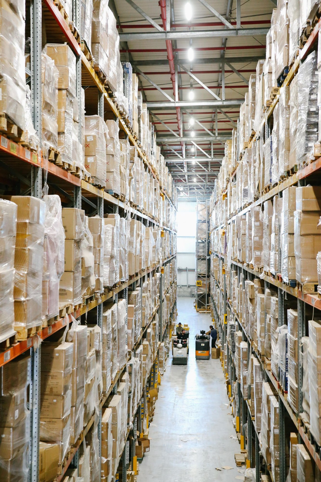 Storage racks and goods inside a working warehouse
